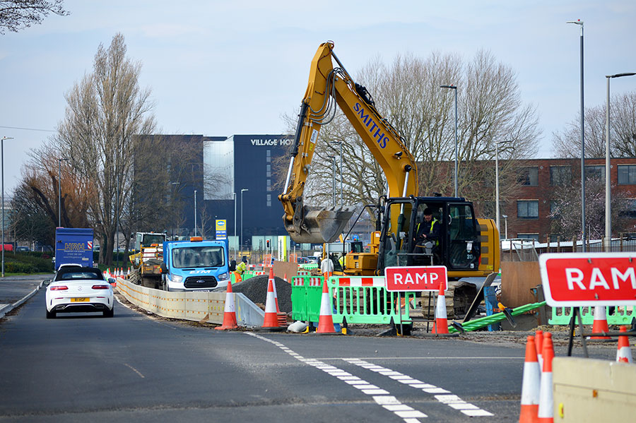 Photo of an excavator working on a road scheme.