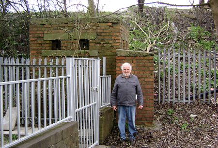 Brian Hawkins pictured beside the WWII pill box near Gipsy Patch Lane railway bridge that he is fighting to save.