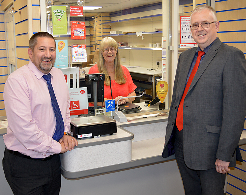 Jhoots directors and staff at the newly-refurbished post office in Ratcliffe Drive, Stoke Gifford. L-r: Richard Sugden (operations manager), Hazel Phelps (post office assistant) and Roger Herbert (director of primary care).