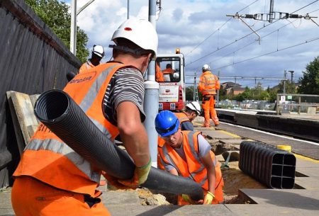 Network Rail workers in action on a station platform.