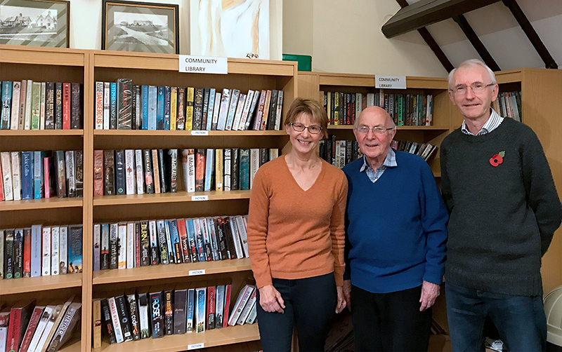 Photo of volunteers who run the community library.
