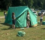 1st Little Stoke Scouts: Erecting tents at summer camp.
