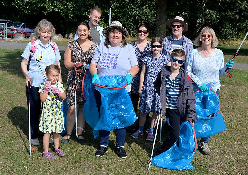 Photo of Jenny James (centre) with some of the local residents who took part in a recent litter pick in the park.