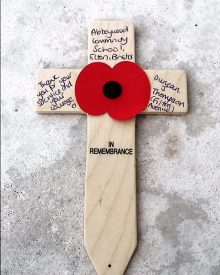 Photo of the annotated cross left beside Duncan J Thompson’s name on a memorial at Tyne Cot cemetery.