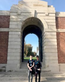 Photo of Tom and Anish outside Lijssenthoek cemetery.