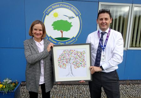 Photo of Anne Sargent presenting Scott Howes with the fingerprint tree.