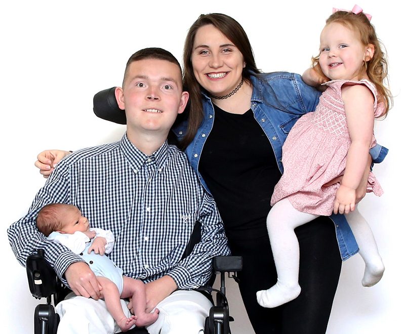 Photo of Mitch Coles with his partner, Alice, and their two children, Aubrey and Ethan.
