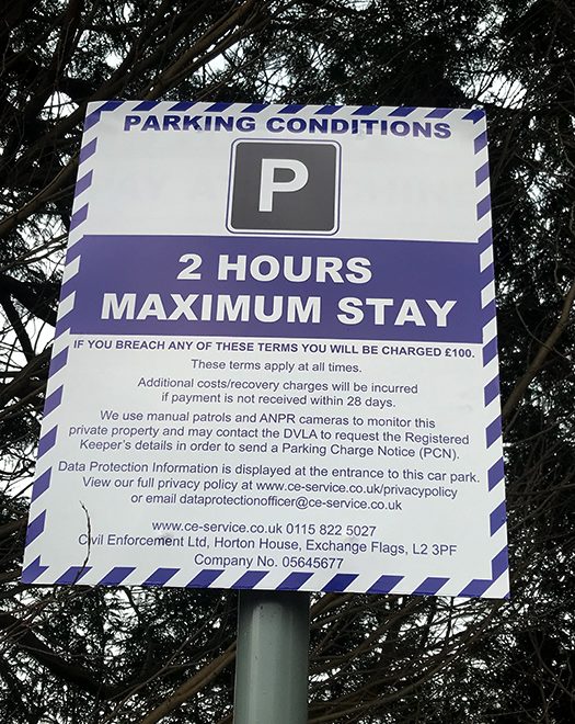 Photo of parking conditions signage (detail).