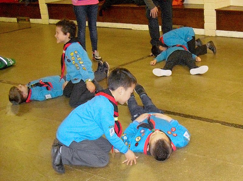 Photo of Beaver Scouts receiving first aid training from St John Ambulance volunteers.