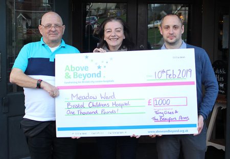 Photo of the charity cheque presentation in front of the Beaufort Arms.