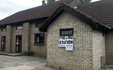 Photo of the outside of a polling station at the Trust Hall.