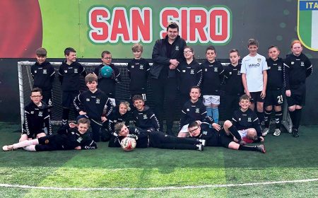 Photo of Stoke Lane Lions Under 10s football team standing in front of a goal.