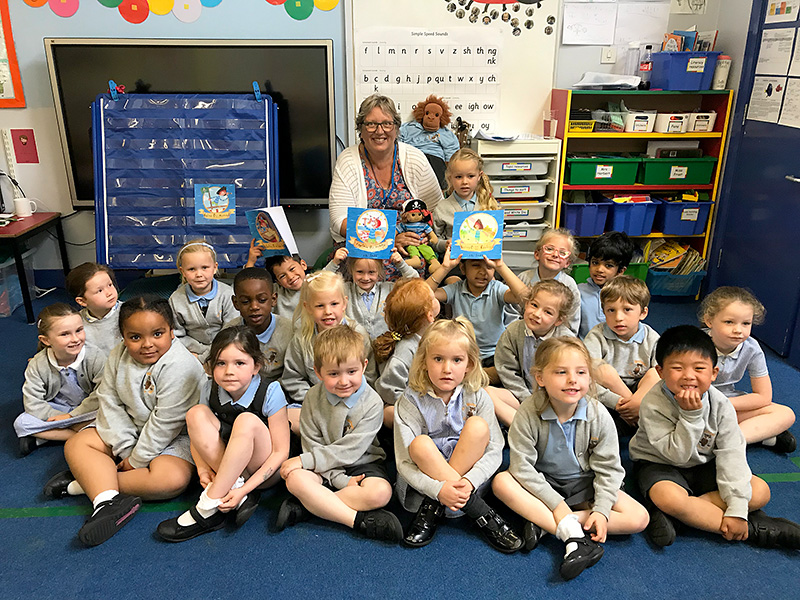 Photo of author Ali Smith with some of the Reception class children.
