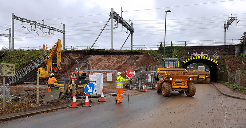 Photo showing excavation of the embankment adjacent to the existing railway bridge.