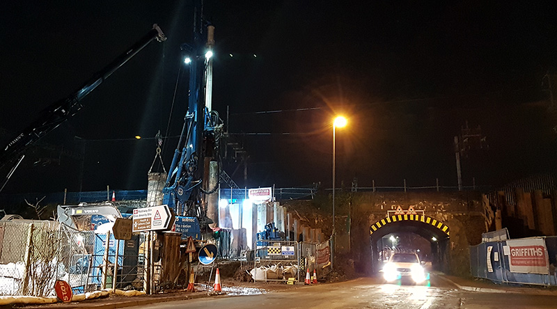 Photo of night-time piling work at the bridge.
