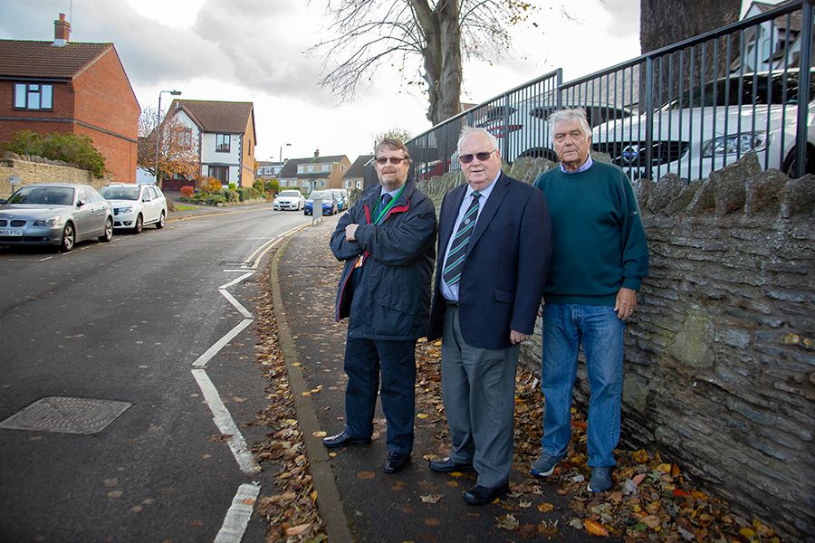 Photo of Stoke Gifford ward councillors (l-r) Keith Cranney, Brian Allinson and Ernie Brown standing on the pavement in North Road.