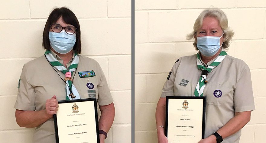 Photo of two Scout leaders holding award certificates.