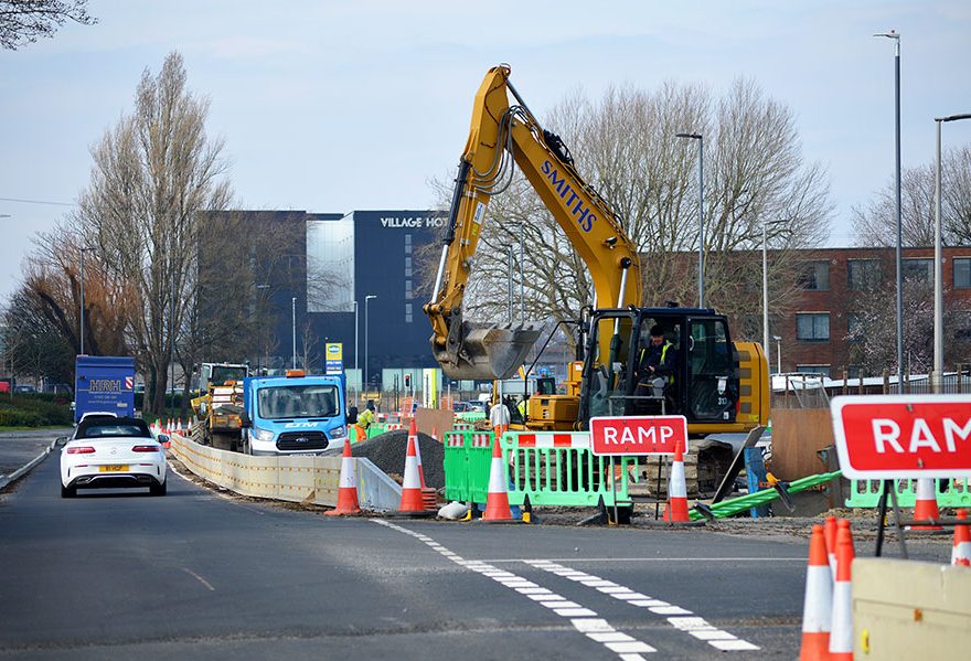 Photo of an excavator working on a road scheme.