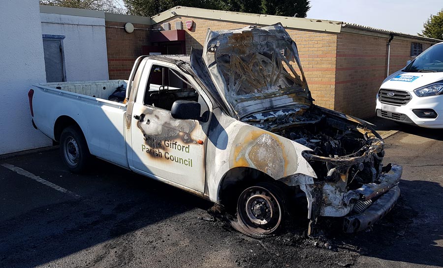 Photo of a fire-damaged pick-up truck.