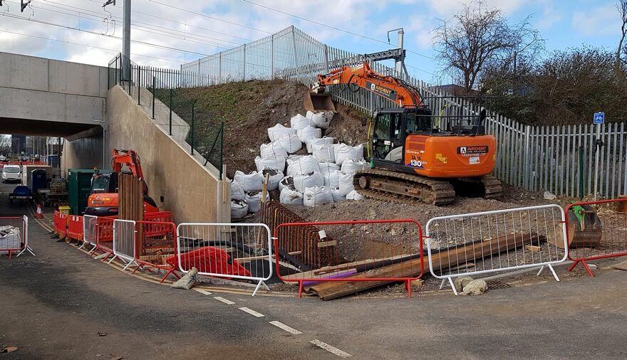 Photo of works under way on a railway embankment.