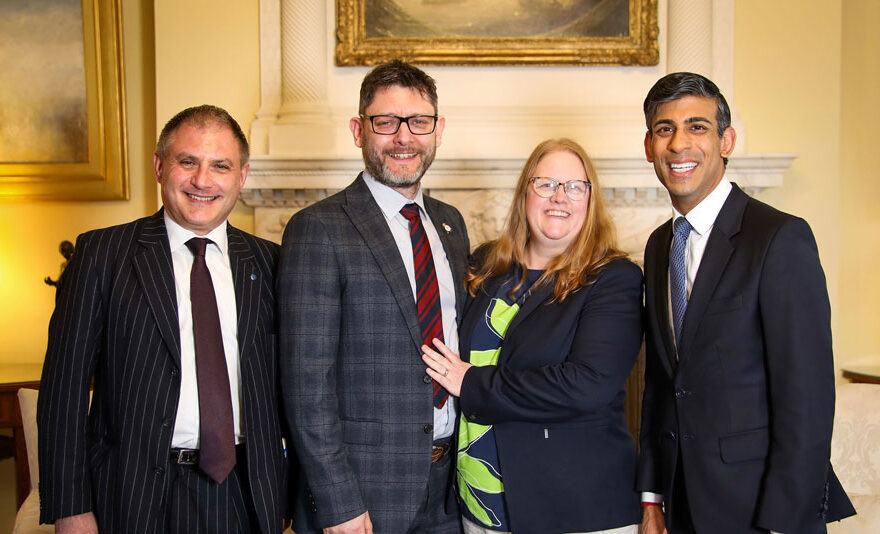 Photo of four people, including the prime minister, in 10 Downing Street.