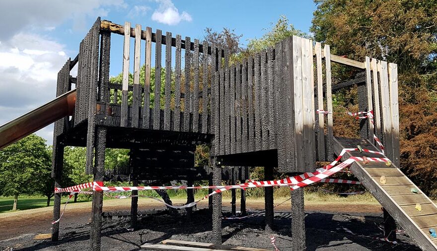 Photo of fire-damaged play equipment.