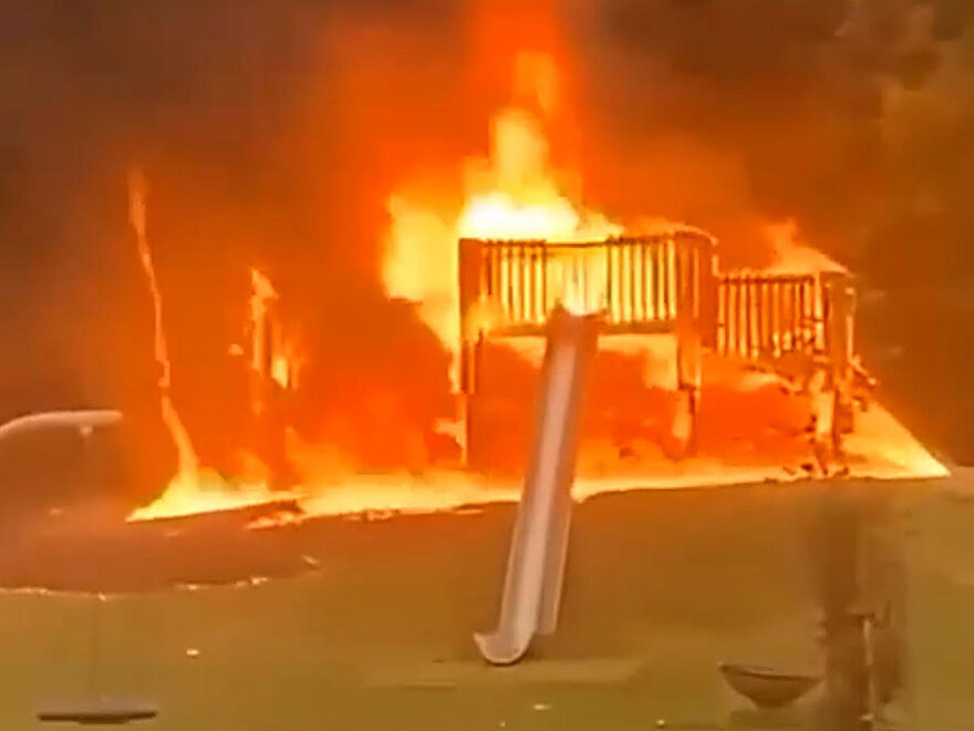 Photo of play equipment on fire.